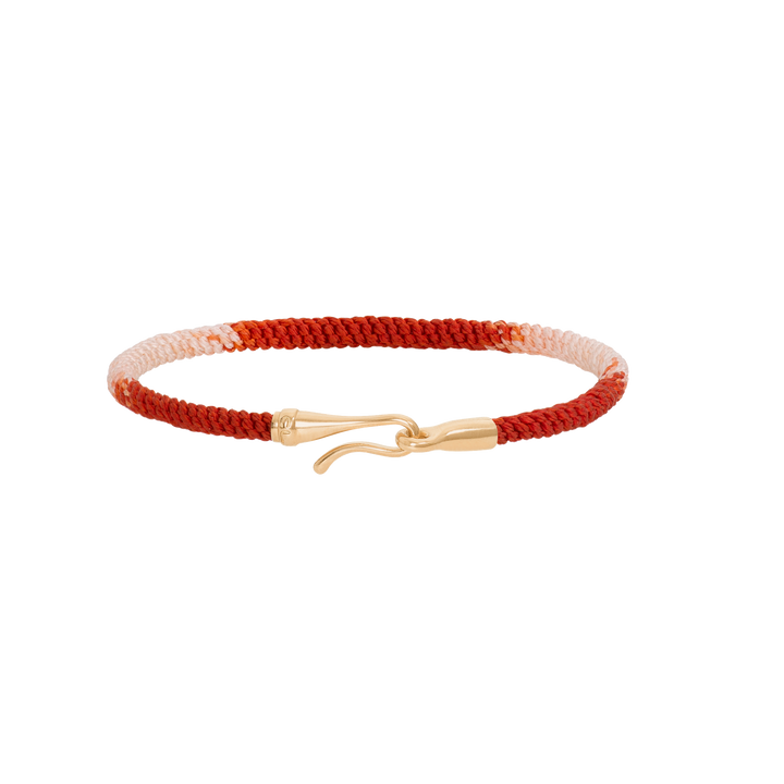 Ole Lynggaard Life Armband, geflochtenes Stoffarmband in der Farbkombination Rot-Weiß mit einem goldenen Hakenverschluss.